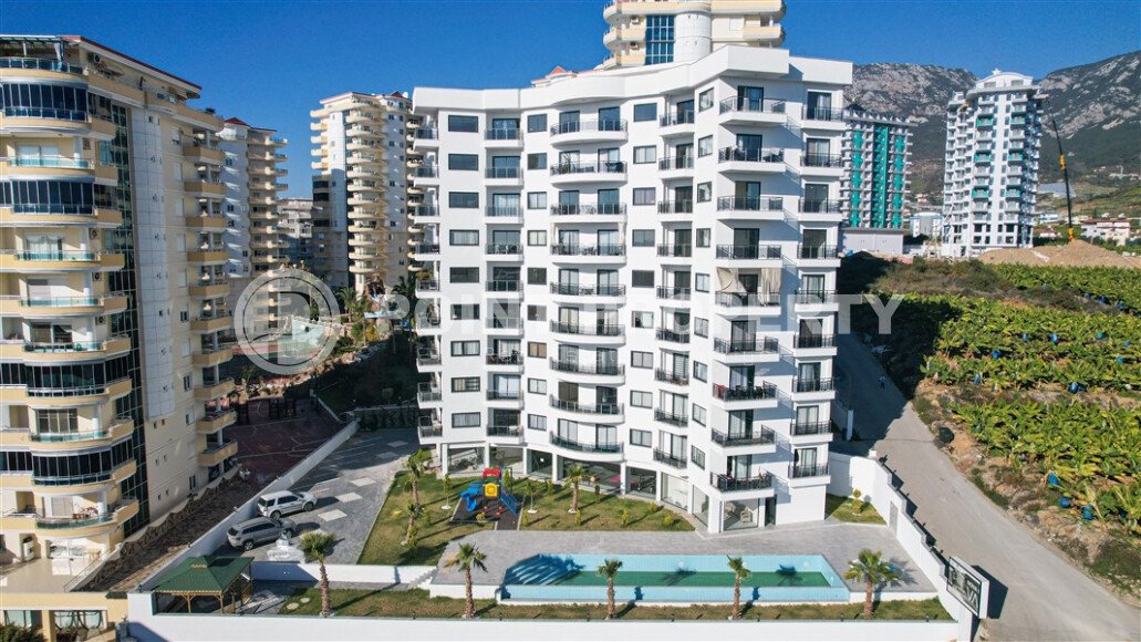 Квартира 1+1 площадью 55 м² с панорамным видом на море в районе Махмутлар-id-9563-фото-7