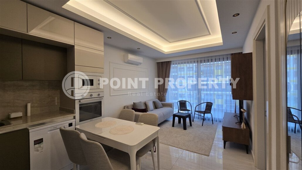Modern apartment 60 m² in Mahmutlar on the first line with furniture and mountain view-id-9645-photo-1