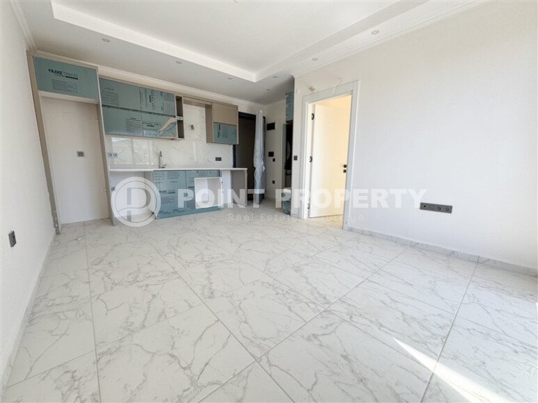 Апартаменты на срочной продаже в новом доме в районе Махмутлар-id-9714-фото-2