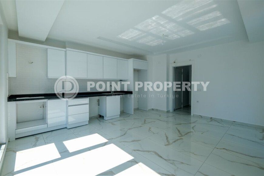 New 1+1 apartment with finished renovation in Mahmutlar area-id-9757-photo-2