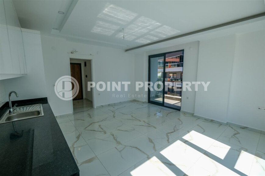 New 1+1 apartment with finished renovation in Mahmutlar area-id-9757-photo-4