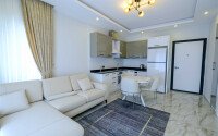 Современная светлая квартира 1+1 площадью 47 м² в жилом комплексе в Авсалларе-id-9808-фото-1