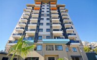 Современная светлая квартира 1+1 площадью 47 м² в жилом комплексе в Авсалларе-id-9808-фото-9