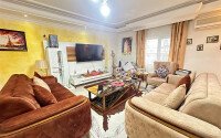 A bright furnished apartment with a functional layout and a balcony converted into a full-fledged living area.-id-9815-photo-2