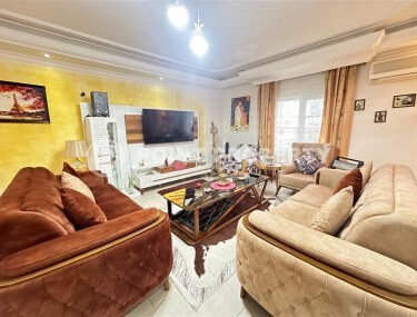 A bright furnished apartment with a functional layout and a balcony converted into a full-fledged living area.-id-9815-photo-2