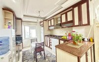A bright furnished apartment with a functional layout and a balcony converted into a full-fledged living area.-id-9815-photo-4