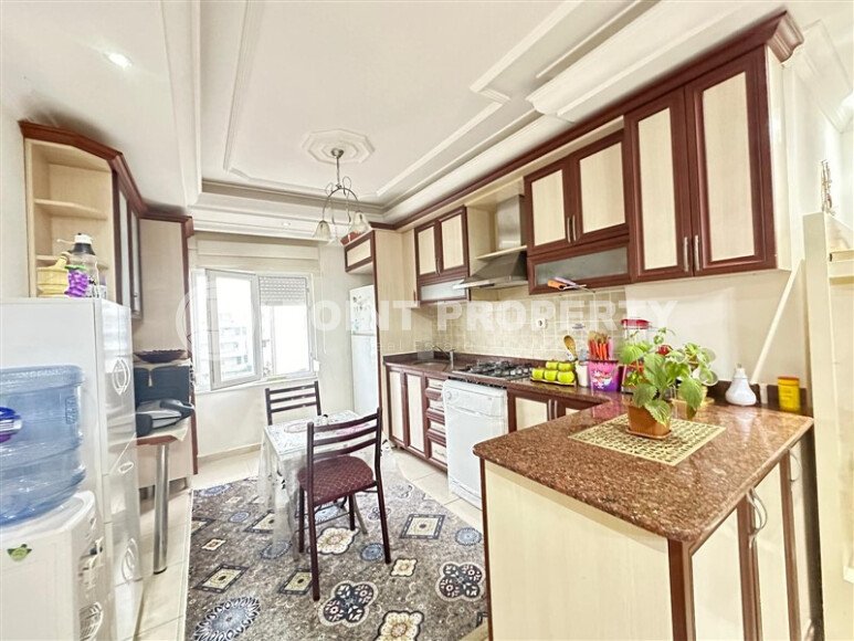A bright furnished apartment with a functional layout and a balcony converted into a full-fledged living area.-id-9815-photo-4