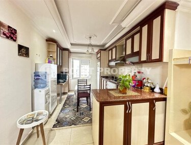 A bright furnished apartment with a functional layout and a balcony converted into a full-fledged living area.-id-9815-photo-5