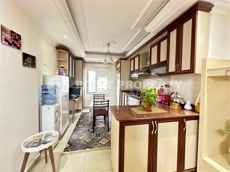 A bright furnished apartment with a functional layout and a balcony converted into a full-fledged living area.-id-9815-photo-5