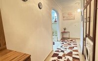 A bright furnished apartment with a functional layout and a balcony converted into a full-fledged living area.-id-9815-photo-6