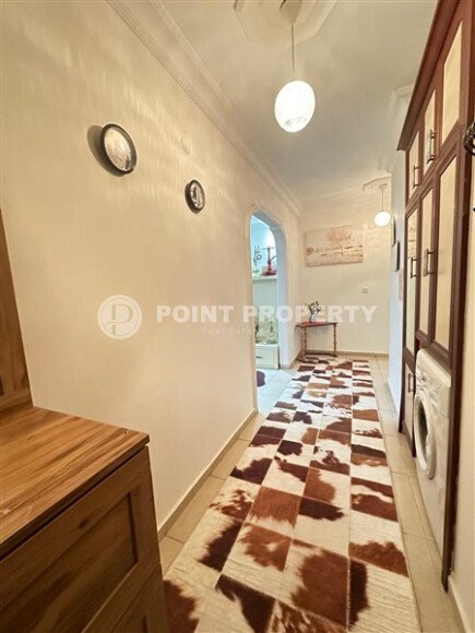 A bright furnished apartment with a functional layout and a balcony converted into a full-fledged living area.-id-9815-photo-6