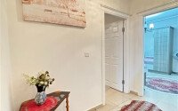 A bright furnished apartment with a functional layout and a balcony converted into a full-fledged living area.-id-9815-photo-7