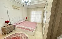 A bright furnished apartment with a functional layout and a balcony converted into a full-fledged living area.-id-9815-photo-8