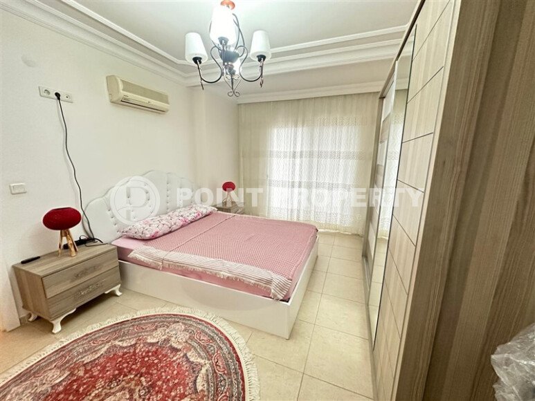 A bright furnished apartment with a functional layout and a balcony converted into a full-fledged living area.-id-9815-photo-8