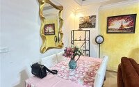 A bright furnished apartment with a functional layout and a balcony converted into a full-fledged living area.-id-9815-photo-9