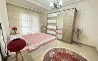 A bright furnished apartment with a functional layout and a balcony converted into a full-fledged living area.-id-9815-photo-10