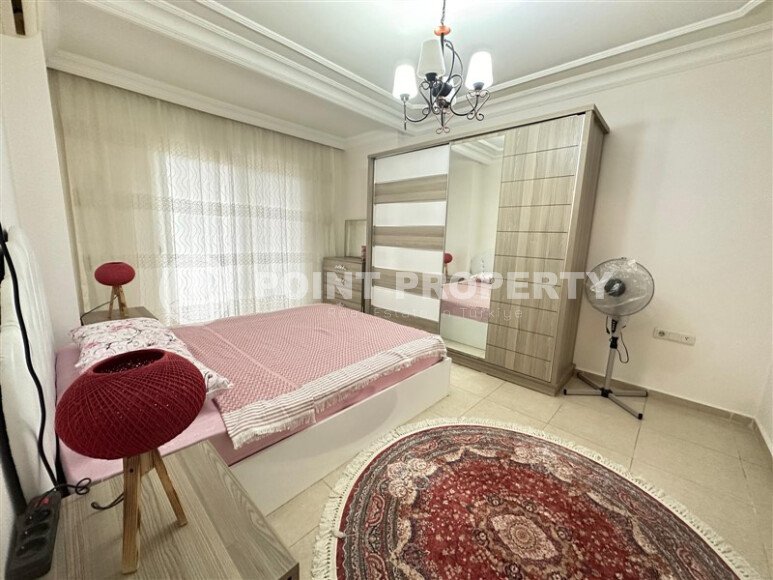 A bright furnished apartment with a functional layout and a balcony converted into a full-fledged living area.-id-9815-photo-10