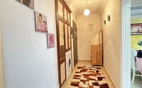 A bright furnished apartment with a functional layout and a balcony converted into a full-fledged living area.-id-9815-photo-11
