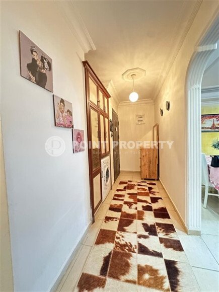 A bright furnished apartment with a functional layout and a balcony converted into a full-fledged living area.-id-9815-photo-11