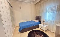 A bright furnished apartment with a functional layout and a balcony converted into a full-fledged living area.-id-9815-photo-12