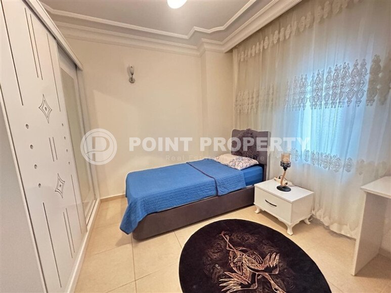 A bright furnished apartment with a functional layout and a balcony converted into a full-fledged living area.-id-9815-photo-12