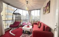 A bright furnished apartment with a functional layout and a balcony converted into a full-fledged living area.-id-9815-photo-14