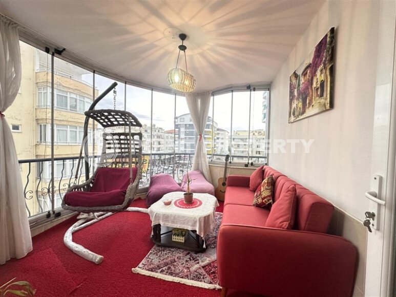 A bright furnished apartment with a functional layout and a balcony converted into a full-fledged living area.-id-9815-photo-14