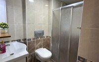 A bright furnished apartment with a functional layout and a balcony converted into a full-fledged living area.-id-9815-photo-16