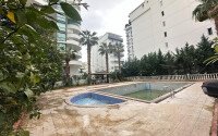 A bright furnished apartment with a functional layout and a balcony converted into a full-fledged living area.-id-9815-photo-17