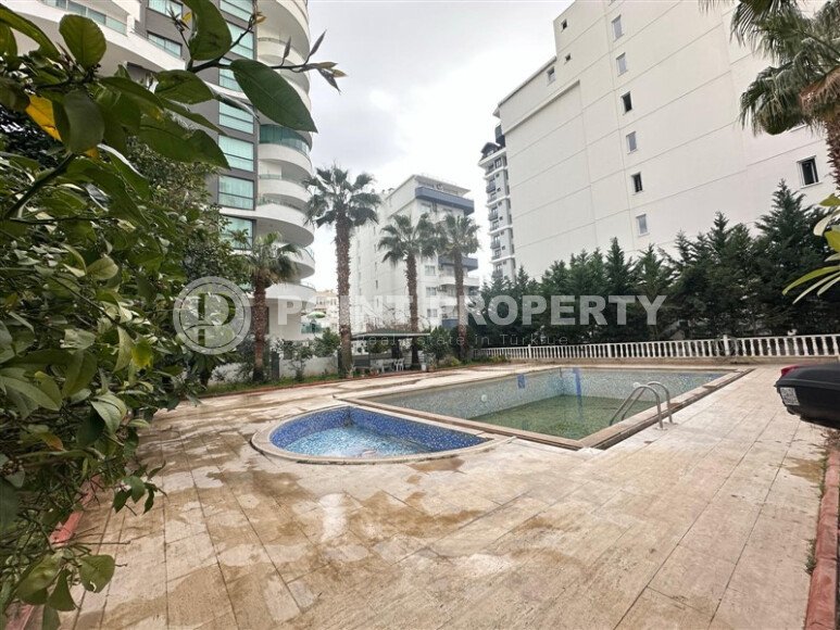 A bright furnished apartment with a functional layout and a balcony converted into a full-fledged living area.-id-9815-photo-17