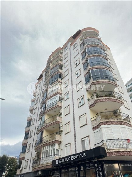 A bright furnished apartment with a functional layout and a balcony converted into a full-fledged living area.-id-9815-photo-18
