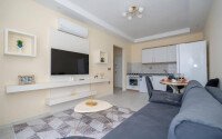 Стильная квартира 1+1, 50 м², в новом доме 2022 года в Махмутларе, 500 м до моря-id-9833-фото-1