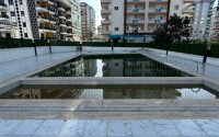 Стильная квартира 1+1, 50 м², в новом доме 2022 года в Махмутларе, 500 м до моря-id-9833-фото-13