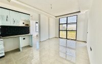 Светлая квартира 2+1 70 м² в новом комплексе – район Махмутлар-id-9837-фото-4