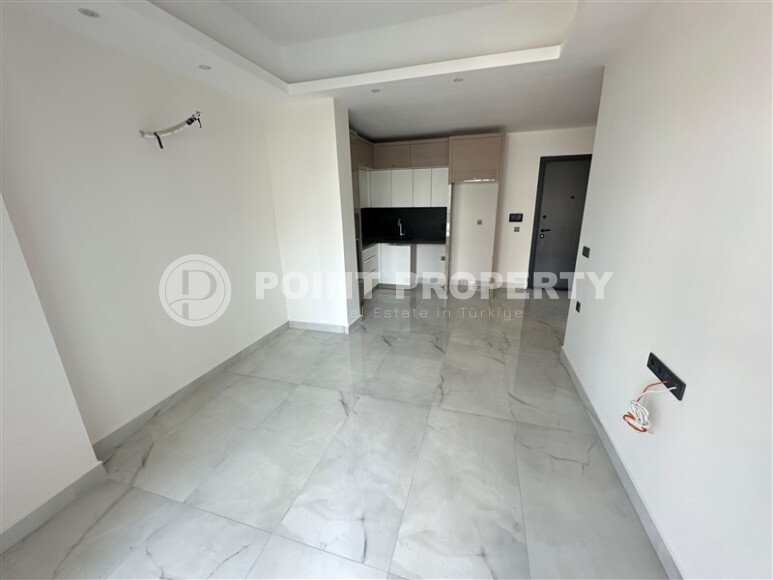 Современная квартира 1+1 в дизайнерском комплексе 2024 года в Махмутларе-id-9860-фото-3