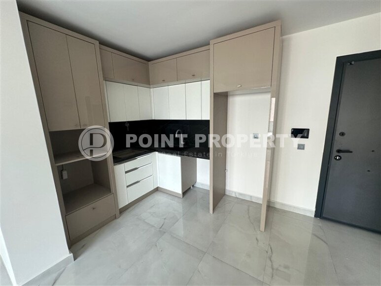 Современная квартира 1+1 в дизайнерском комплексе 2024 года в Махмутларе-id-9860-фото-4