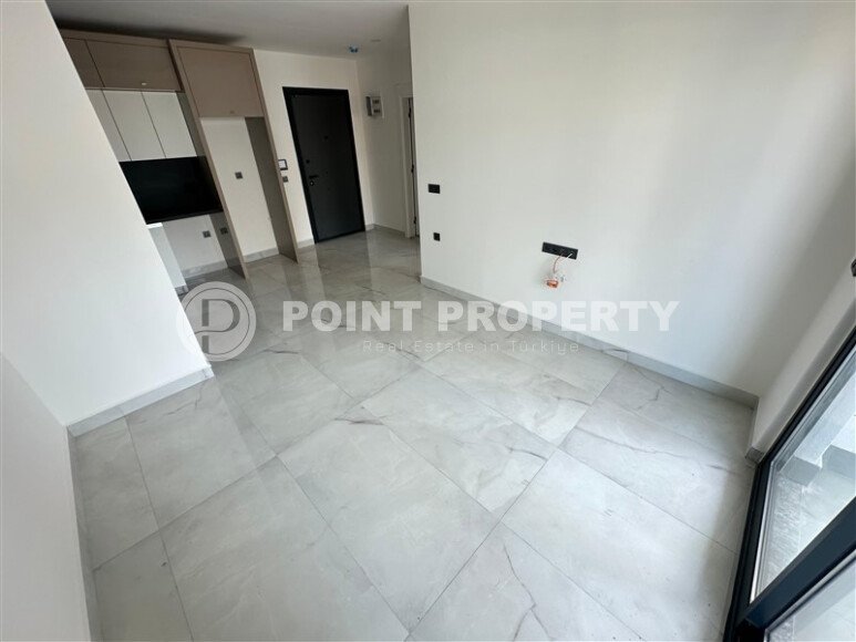 Современная квартира 1+1 в дизайнерском комплексе 2024 года в Махмутларе-id-9860-фото-5