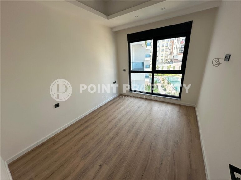 Современная квартира 1+1 в дизайнерском комплексе 2024 года в Махмутларе-id-9860-фото-7