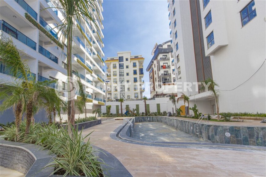 Современная квартира 1+1 в дизайнерском комплексе 2024 года в Махмутларе-id-9860-фото-13