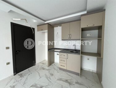 2+1 apartment with an area of 75 m² in a new residential complex in the center of Mahmutlar-id-9863-photo-3