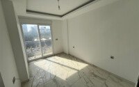 Квартира 2+1 площадью 75 м² в новом жилом комплексе в центре Махмутлара-id-9863-фото-4