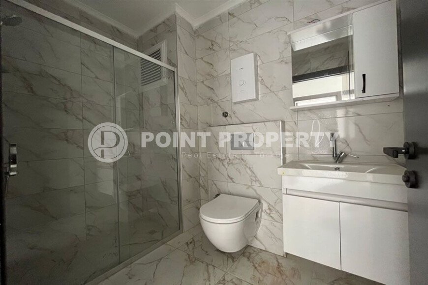 2+1 apartment with an area of 75 m² in a new residential complex in the center of Mahmutlar-id-9863-photo-7