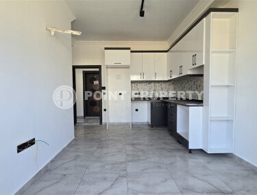 Современная квартира 1+1 рядом с морем, 50 м², район Кестель-id-9864-фото-3