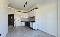 Современная квартира 1+1 рядом с морем, 50 м², район Кестель-id-9864-фото-6
