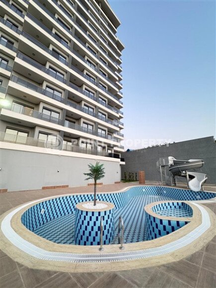 Светлый дуплекс 100 м² с видом на море в новом комплексе района Махмутлар-id-9873-фото-14