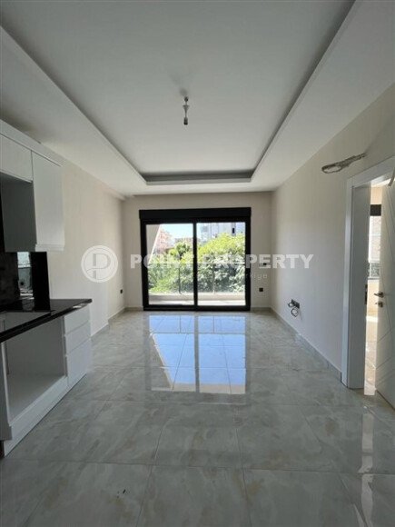 Современная квартира 50 м² в комплексе с инфраструктурой в Махмутларе-id-9897-фото-2