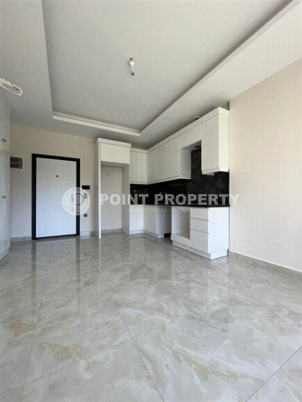 Современная квартира 50 м² в комплексе с инфраструктурой в Махмутларе-id-9897-фото-3