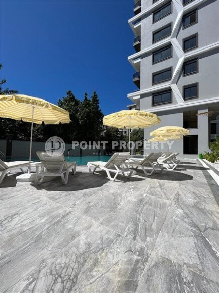 Современная квартира 50 м² в комплексе с инфраструктурой в Махмутларе-id-9897-фото-22