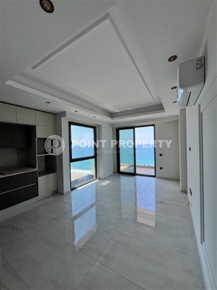 2+1 apartment with direct sea view in an ultra-modern complex on the first coastline in Mahmutlar-id-9898-photo-4