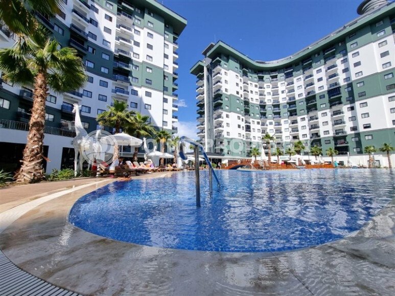 Срочная продажа квартиры 1+1 с мебелью в комплексе с отельной инфраструктурой в Махмутларе-id-9906-фото-25